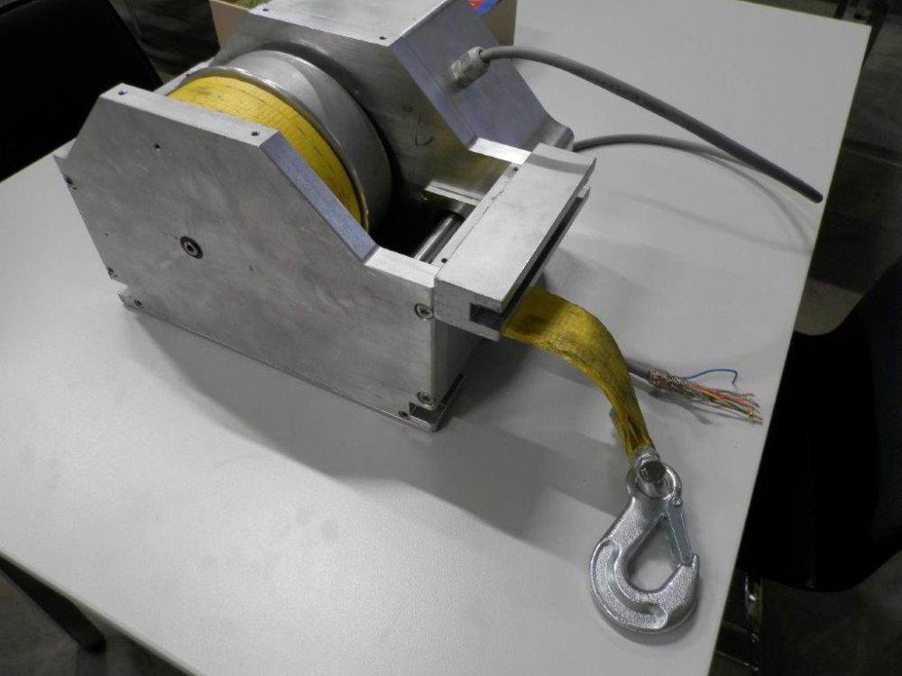 La pièce maîtresse est un moteur électrique qui permet d'arrimer chaque sangle de serrage de manière réglable individuellement jusqu'à 500 kg. Foto: Süss